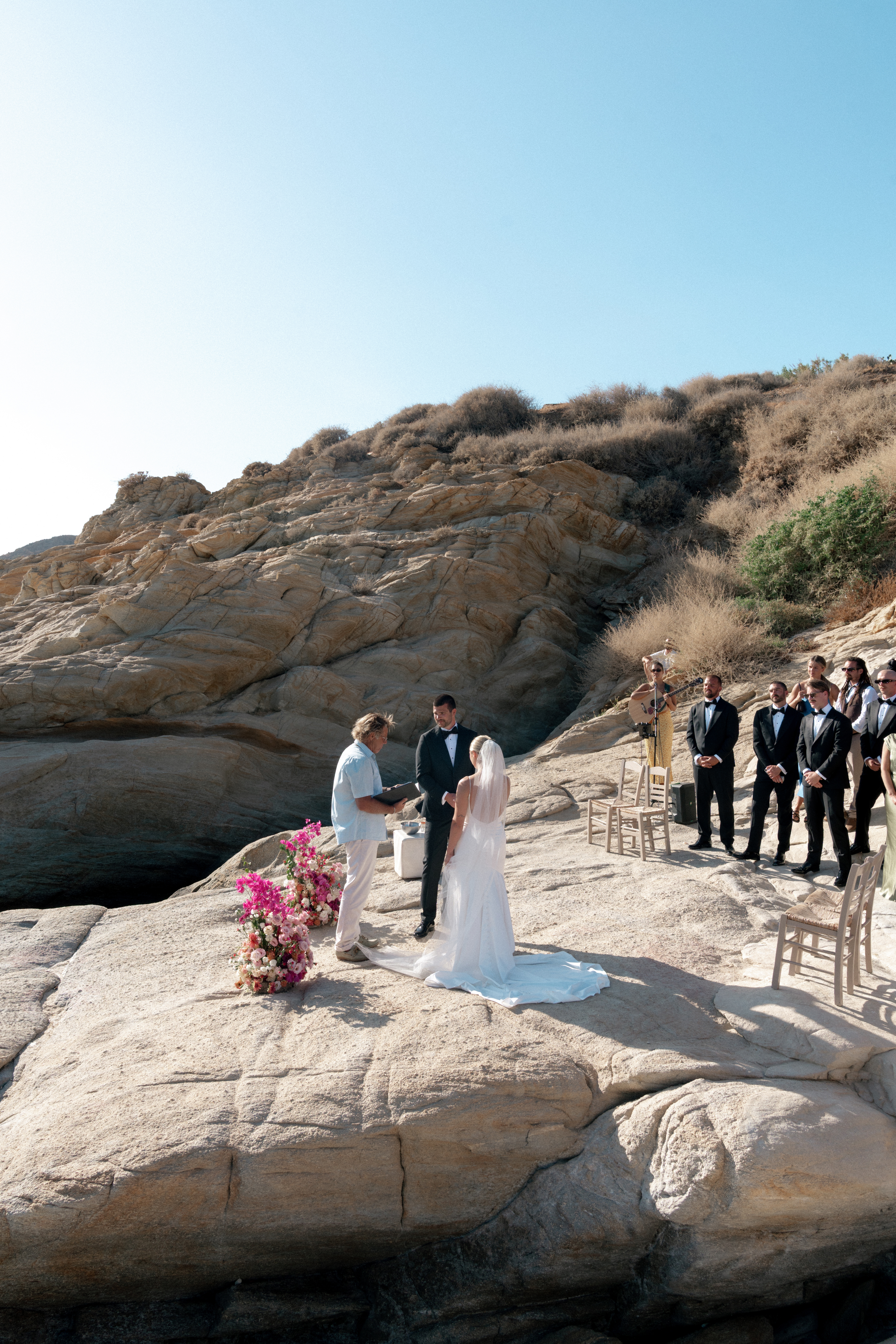 Wedding venue in Ios, Greece. Seaside wedding ceremony at Harmony Restaurant and bar, Mylapotas Beach, Cycalades, Greece.